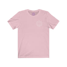 Load image into Gallery viewer, Pink t-shirt with a Mystical Pixel logo on the left side of the chest. There is a purple version of the logo where the tag of the shirt usually would be.