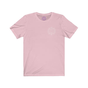 Pink t-shirt with a Mystical Pixel logo on the left side of the chest. There is a purple version of the logo where the tag of the shirt usually would be.