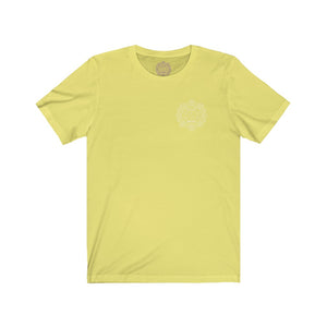 Light yellow t-shirt with a Mystical Pixel logo on the left side of the chest. There is a purple version of the logo where the tag of the shirt usually would be.