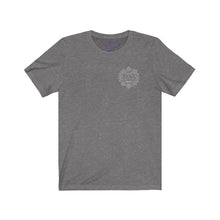 Load image into Gallery viewer, Grey t-shirt with a Mystical Pixel logo on the left side of the chest. There is a purple version of the logo where the tag of the shirt usually would be.