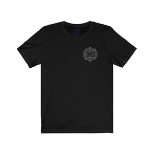 Black t-shirt with a Mystical Pixel logo on the left side of the chest. There is a purple version of the logo where the tag of the shirt usually would be.